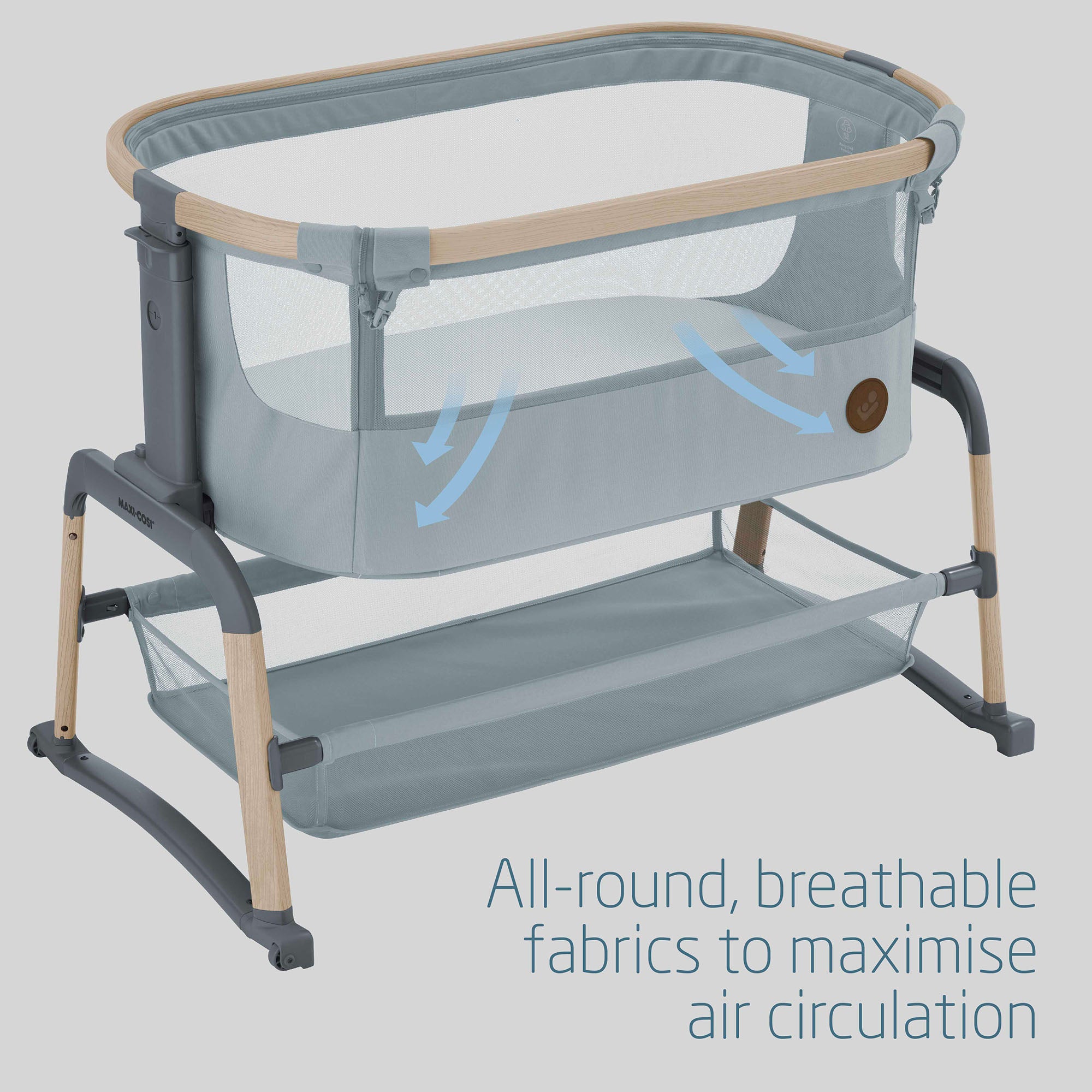 Portable crib with text about breathable fabrics and air circulation on a gray background