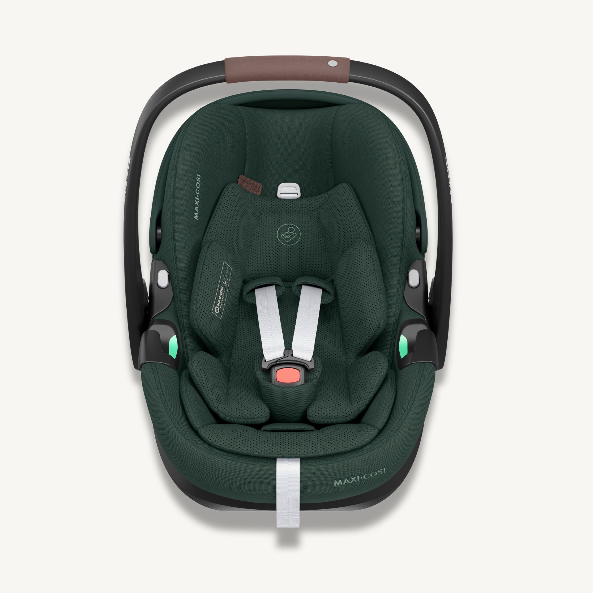 Front view of a dark green Maxi-Cosi Pebble 360 Pro² baby car seat with white harness straps on a light cream background.