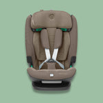 Front view of a truffle brown Maxi-Cosi Titan Pro i-Size car seat with white harness straps on a soft green background.