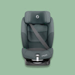 Gray Maxi-Cosi Toddler Car Seat on a green background.